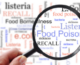 food safety related words blurred out with words in focus under a magnifying glass