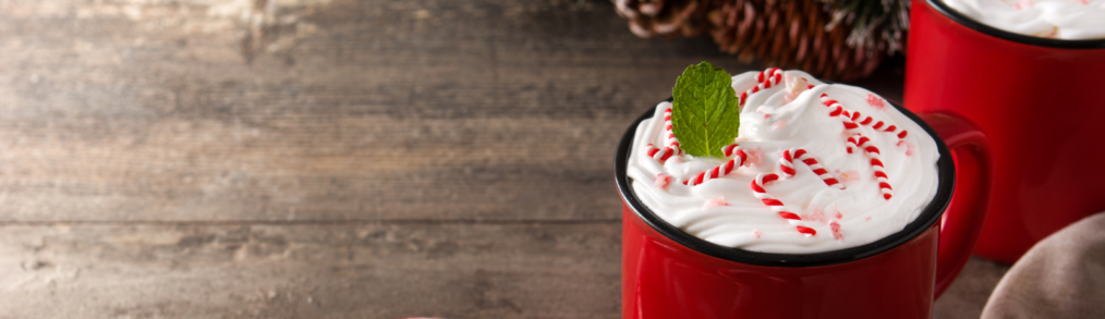 coffee and candy canes on a wooden table