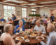 inside a senior living dining room as residents eat lunch